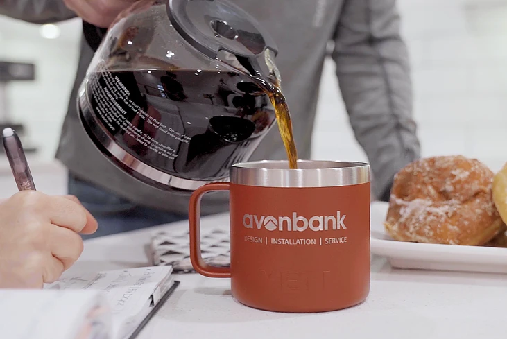 pouring coffee into Avonbank mug